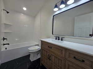 Full bathroom featuring vanity, shower / bathtub combination, dark marble finish floors, and recessed lighting