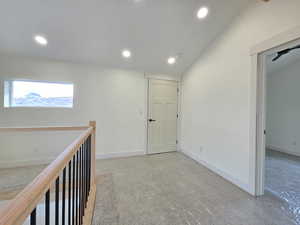 Hallway featuring baseboards and recessed lighting