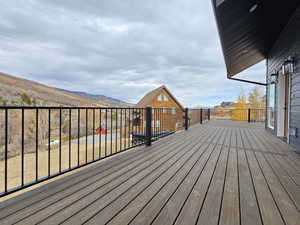 Wooden deck featuring a mountain view