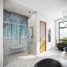 Bathroom with a shower stall and a freestanding tub