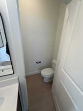 Bathroom with vanity and dark wood-type flooring
