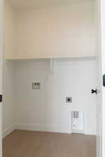 Laundry room featuring washer hookup, light wood-style flooring, and hookup for an electric dryer