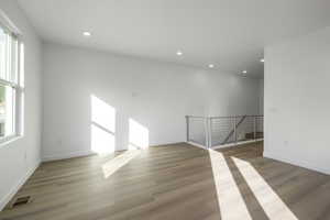 Sun-drenched living room with a clean, modern feel and room to relax