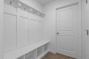 Mudroom with dark wood-style flooring