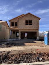 View of front of property with a patio area and a mountain view