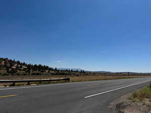 View of asphalt road featuring a mountain view