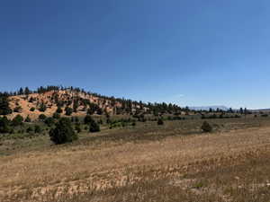 View of mountain backdrop featuring rural landscape
