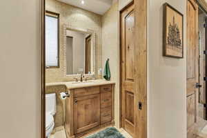 Bathroom with vanity and recessed lighting