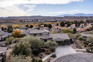 Aerial view of residential area featuring a mountainous background