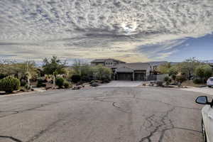 View of front of house featuring driveway and an attached garage