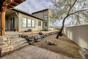 Back of house featuring a patio area and stucco siding