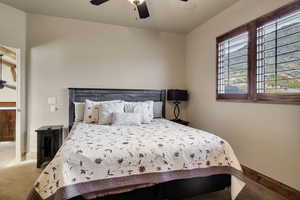 Bedroom with carpet flooring and a ceiling fan