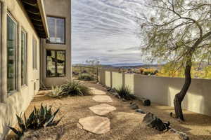 Fenced backyard featuring a mountain view