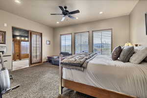 Carpeted bedroom with ceiling fan and recessed lighting