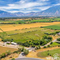 Overview of rural landscape featuring a mountainous background