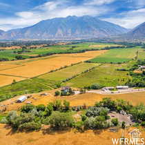 Overview of rural landscape with a mountain backdrop