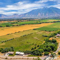 View of mountain backdrop with rural landscape