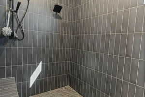 Bathroom featuring a tile shower