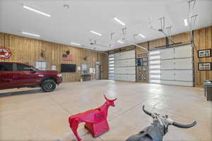 Garage featuring wooden walls