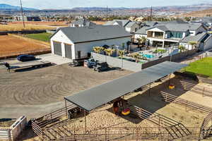 Aerial view of sparsely populated area with mountains and nearby suburban area