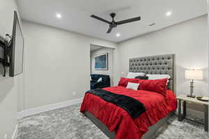 Bedroom featuring light carpet, a ceiling fan, and recessed lighting