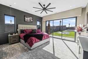 Bedroom with access to outside, a ceiling fan, light colored carpet, and recessed lighting