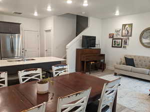 Dining space featuring stairs and wood finished floors