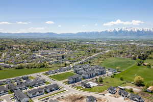 Aerial perspective of suburban area with a mountain backdrop
