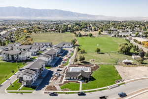 Aerial view of residential area featuring a mountainous background