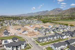 Aerial view of property's location featuring nearby suburban area and mountains