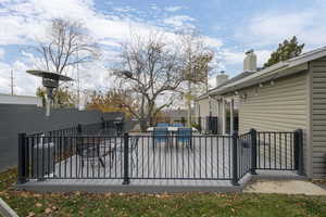 Wooden deck featuring a patio area and outdoor dining space