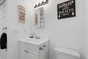 Bathroom with vanity and toilet