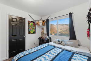 Bedroom featuring wood finished floors and baseboards