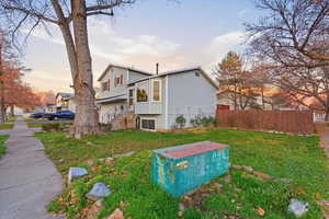View of back of house at dusk