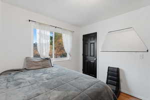 Bedroom with wood finished floors