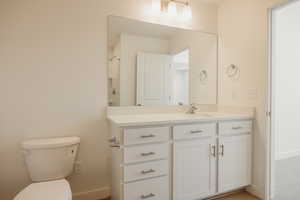 Bathroom featuring vanity and a shower