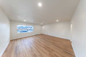 Unfurnished room with recessed lighting and light wood-style floors