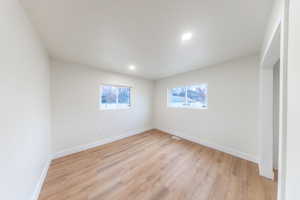Spare room with light wood-style flooring and recessed lighting