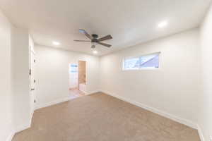 Unfurnished room with light colored carpet, recessed lighting, and a ceiling fan
