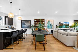Dining area featuring light wood-style floors and recessed lighting