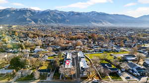 Aerial perspective of suburban area featuring a mountain backdrop