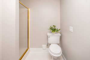 Full bathroom featuring a stall shower and tile patterned floors