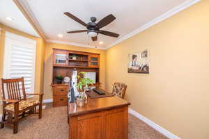 Office space with light colored carpet, ceiling fan, ornamental molding, and recessed lighting