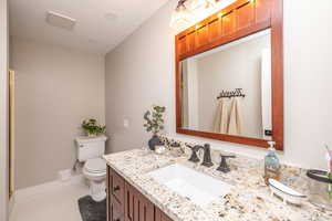 Bathroom featuring vanity and tile patterned flooring