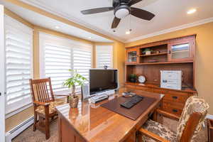 Home office with plenty of natural light, a baseboard heating unit, crown molding, ceiling fan, and recessed lighting
