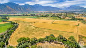 Overview of rural landscape featuring a mountainous background