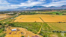 View of rural area with a mountainous background and abundant farmland