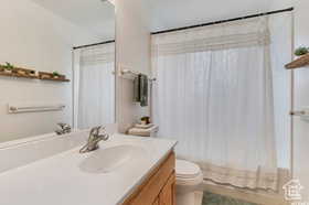 Bathroom with vanity and shower / bath combo