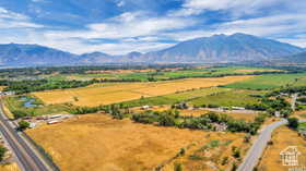 View of mountain backdrop with rural landscape