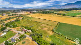 Overview of rural landscape featuring a mountainous background